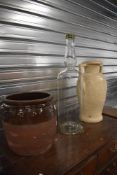 A large vase, a ceramic grain bin and a decanter bottle