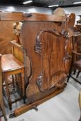 A Victorian bed set having carved head and foot boards with frame