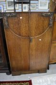An early to mid 20th Century oak bedroom cabinet