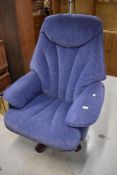 A modern blue plush reclining easy chair