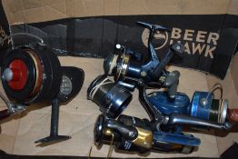 Four spinning reels by DAM, Mitchell, Abu Garcia and a Lineaeffe Elite RD50 with spare spool