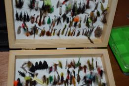 A large collection of fly boxes and wallets some containing flies