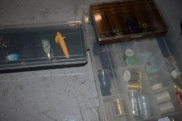 A Wychwood fishing bag containing flies lures and line