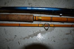 An Allcocks Climax vintage cane rod and a Shakespeare Pro am spin Rod
