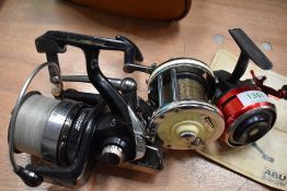 3 spinning or sea fishing reels including Abu 505, Emcast evo 5000 and a mitchell 602ap