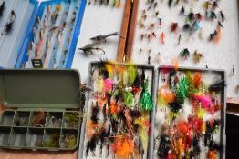 An assortment of 6 boxes and wallets containing fishing flies