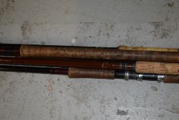 A selection of 5 large fishing rods including Daiwa