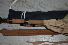 Four fly fishing rods and a landing net