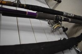 Four boat rods one with a reel attached