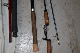 A canvas wrap containing 6 fishing rods including Heron boat/pier rod and 3 split caane fly rods