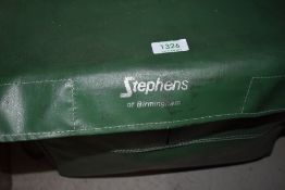 A Stephens fishing tackle box seat, with contents including 5 fishing reels