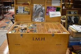 A purpose built handmade wooden chest containing a comprehensive fly tieing kit including vices