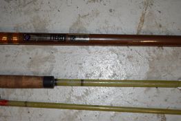 An Abu 484 Atlantic zoom Beach caster and a Fiberglass beach rod
