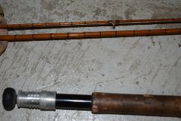 A 3 piece split cane fly rod by Edminson Alnwick with spare tip in canvas sleeve