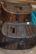 Two wicker fishing creels the smaller one having leather reinforcement