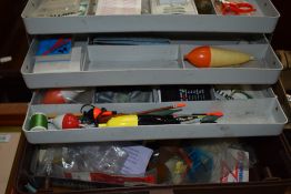 A fishing tackle box and varied contents