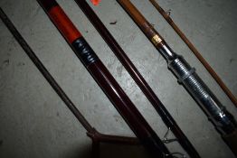 A fishing rod case containing split cane fly rod and carbon rod with spare tip and z rod rests.