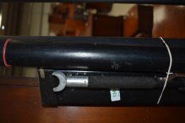 Three empty hard rod cases and a rod rost