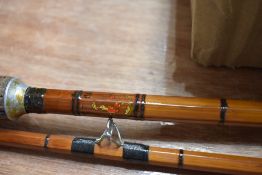 A 3 pc cane rod marked but unreadable