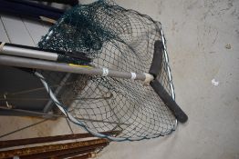 A Shakespeare telescopic landing net and rod rests
