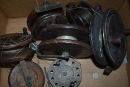 A box of six vintage wooden reels