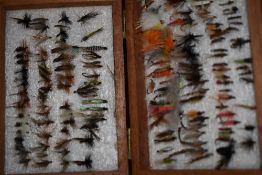 4 wooden boxes containing a very large collection of salmon and trout flies