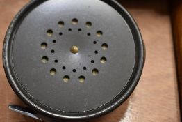 A Hardy Brothers fly reel marked The Perfect 3 7/8 with a grey agate line ring