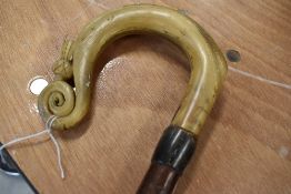 A shepards crook with a thistle carved into the bone handle