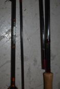 A fibatube Alnwick marked 'hookes of york' 9ft 2 pc fly rod and a 10ft graphite unmarked fly rod