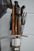 Three shooting sticks three walking sticks and an ice axe
