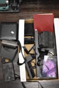 A selection of Polaroid camera equipment including a microscope addaptor