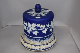 An antique cheese dome in a typical Jasperware design having ivy leaf decoration, lid being AF