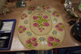 A 20th century hand sewn needlework table centre mat with rose decoration