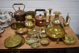 A large collection of antique and later brass and copper wares including candle sticks, kettles