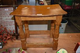 From the workshop of Robert Thompson Mouseman a Lakeland Arts and Crafts golden oak stool, having