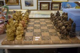 A mid century chess set in the form of mythical fantasy creatures plaster cast with resin board