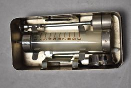 A 20th century syringe in stainless steel case