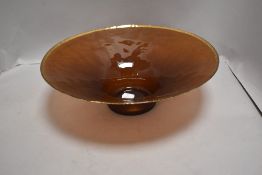 A modern Wedgwood glass bowl having purple hue with a gold banded rim having original box