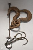 An antique industrial double hook along with a Victorian yard scale set