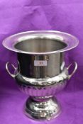 A silver plated campana urn form champagne or wine ice bucket or cooler