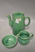 An Ealy 20th century C.H Brannam (Barnstaple) teapot bowl and creamer in green glaze having chips to