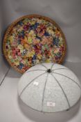 An early 20th century fibre woven basket with cloth lining and an Art Deco glass fly catcher light