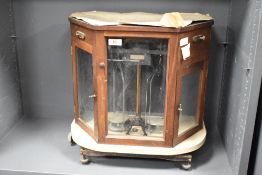 A cased set of laboratory scales
