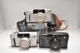 Three Canon cameras, a Canon Z115 Sureshot and two Canon Z135 Sureshot