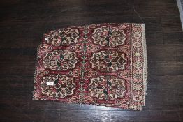 A finely woven hand knotted Turkmen rug having age related loss