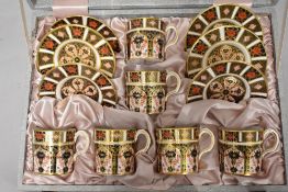 A Royal Crown Derby cased canteen of coffee cups and saucers in a typical Imari design and an