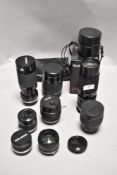 Six lenses. Two Tamron SP telephoto 80-210mm, a Ohnar 300mm mirror lens, a Vivitar 500mm mirror