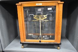 A cased set of Oertling laboratory scales