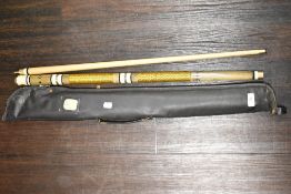 A snooker cue of good quality having label for Atkinson's sports depot Kendal