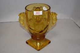 An early 20th century Bagley Art Deco amber glass Koala vase in good condition
